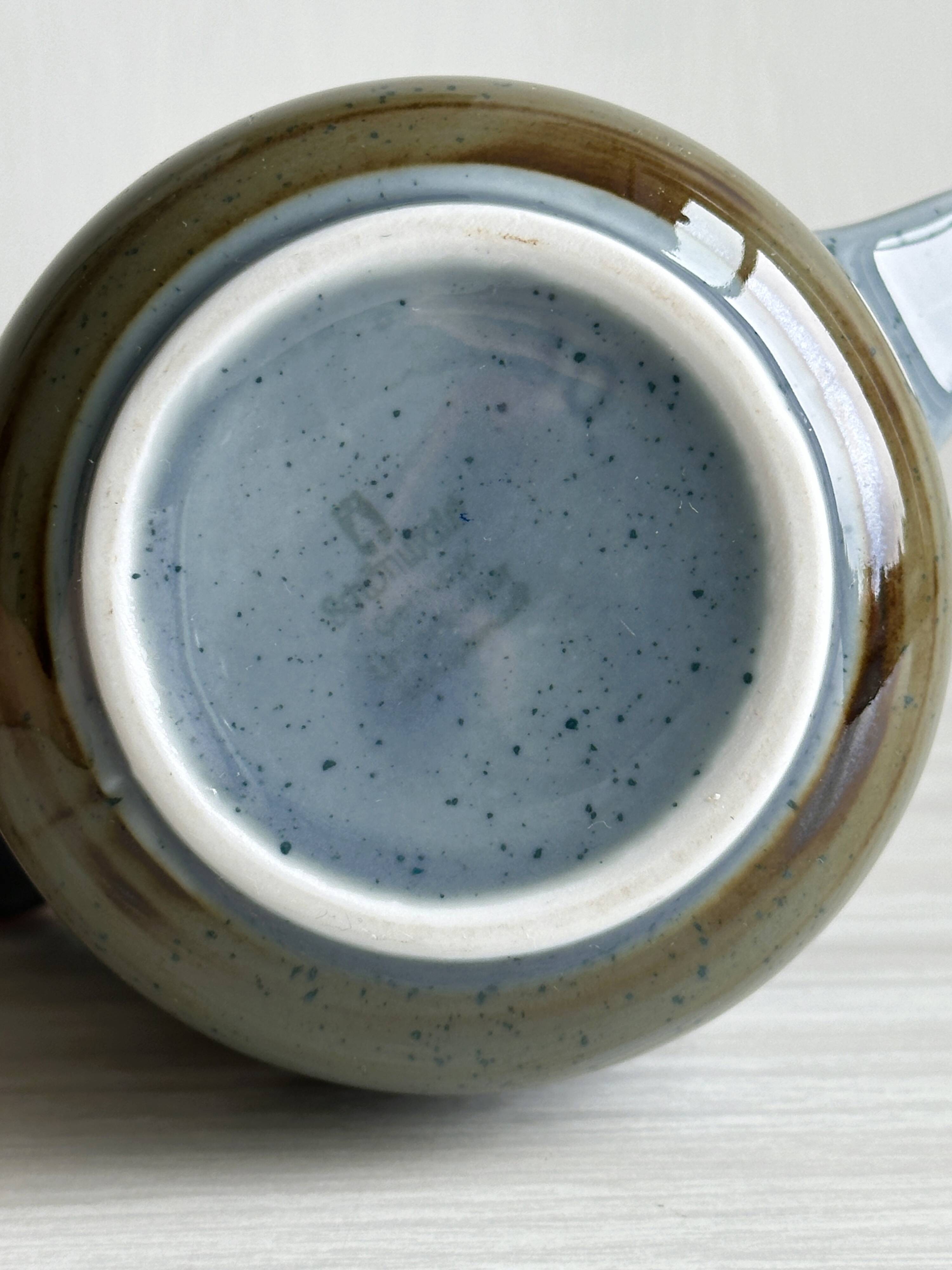 Blue and beige ceramic milk jug