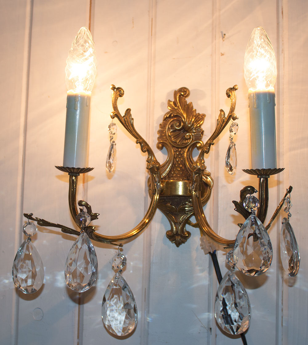 Old brass sconce with glass drops