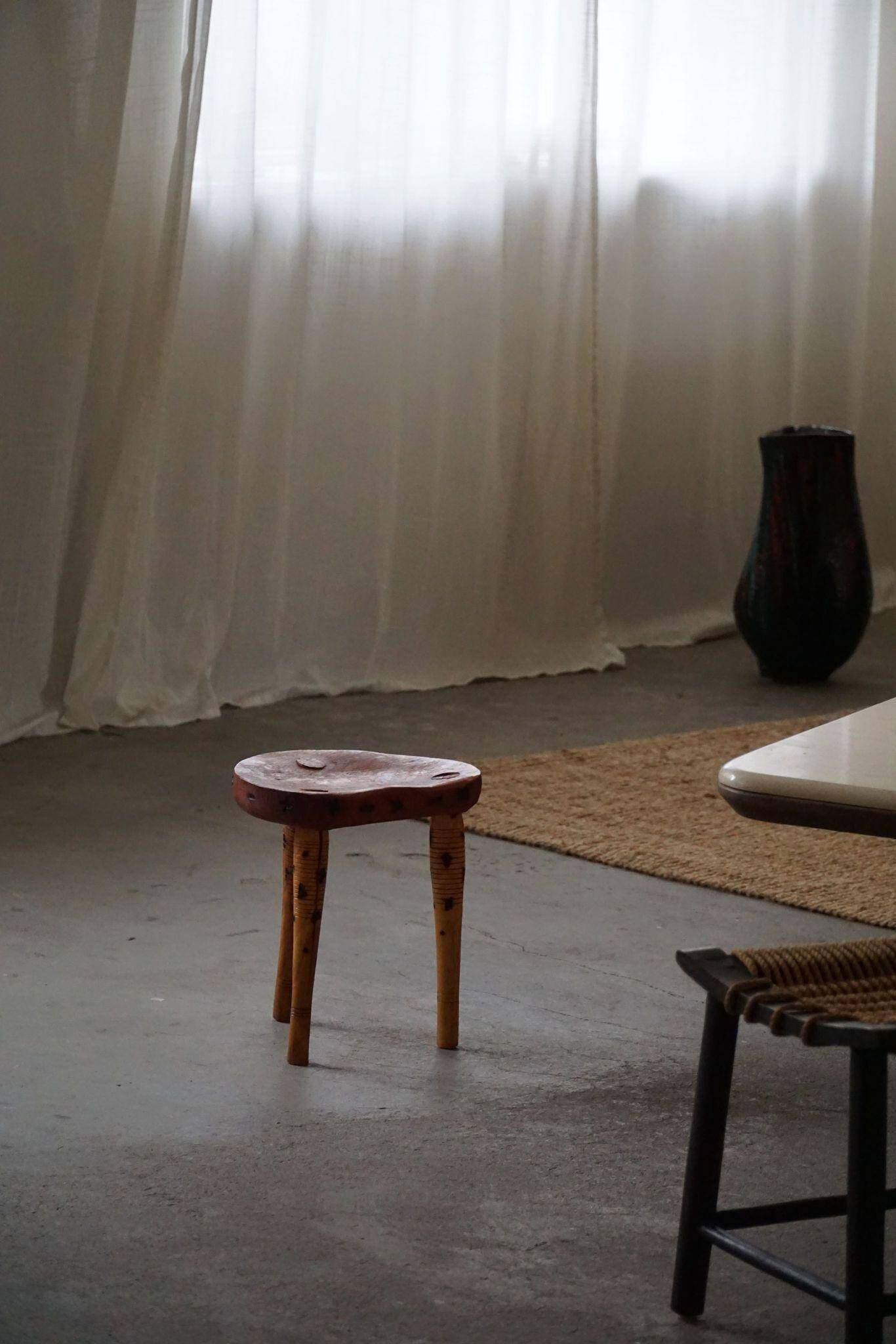 Primitive tripod stool in solid pine, modern Swedish style, from the 1950s.