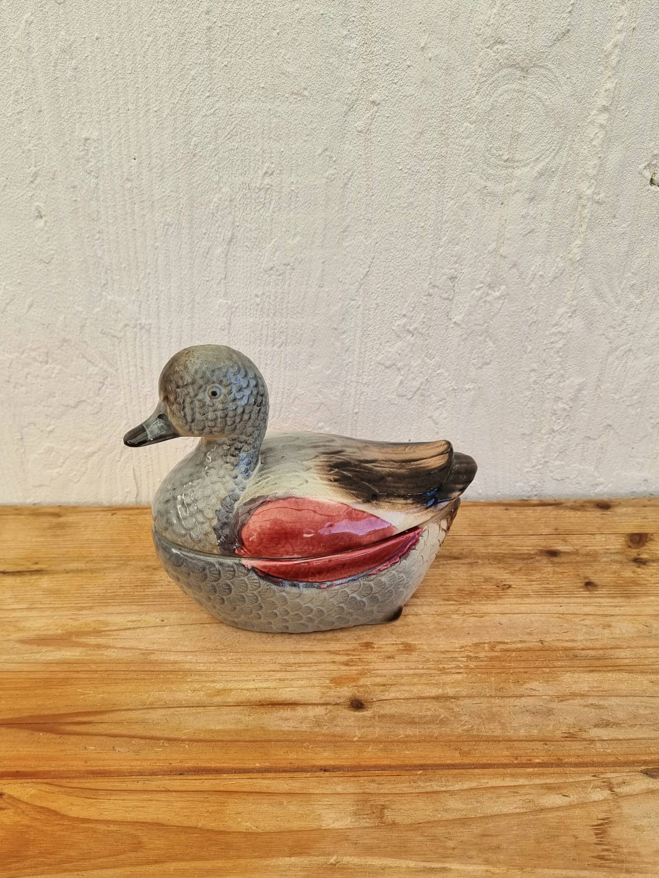 Antique earthenware terrine in the shape of a duck.