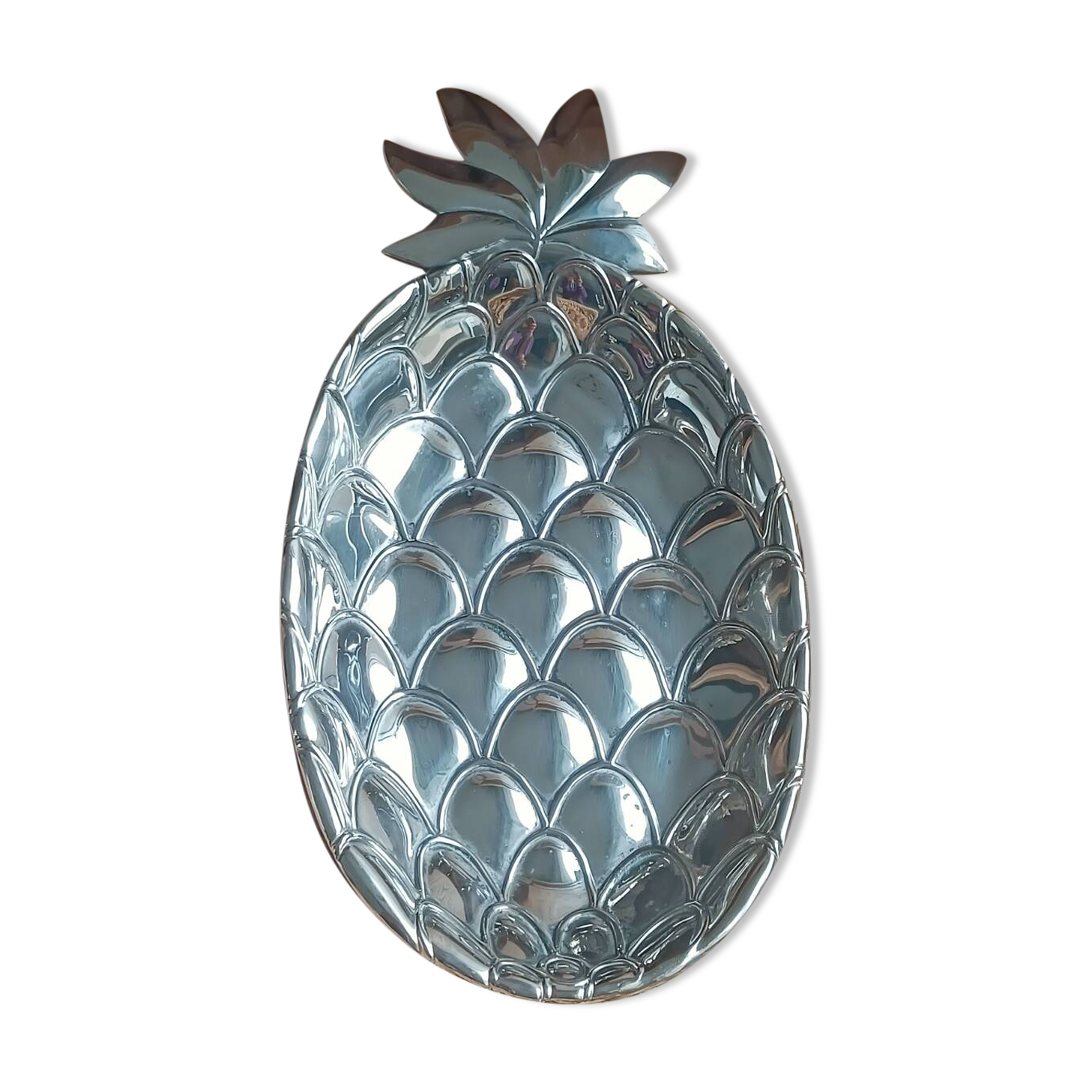 Silver-plated metal tray in the shape of a pineapple.