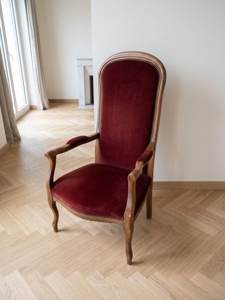 Louis XV style Voltaire armchair in wood and burgundy fabric.
