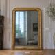 Large gilded Louis-Philippe antique mirror from the 19th century with original glass, measuring 129 x 10 cm.