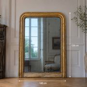 Large gilded Louis-Philippe antique mirror from the 19th century with original glass, measuring 129 x 10 cm.