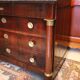 Commodity with mahogany detached columns and Empire gilded bronze ornaments