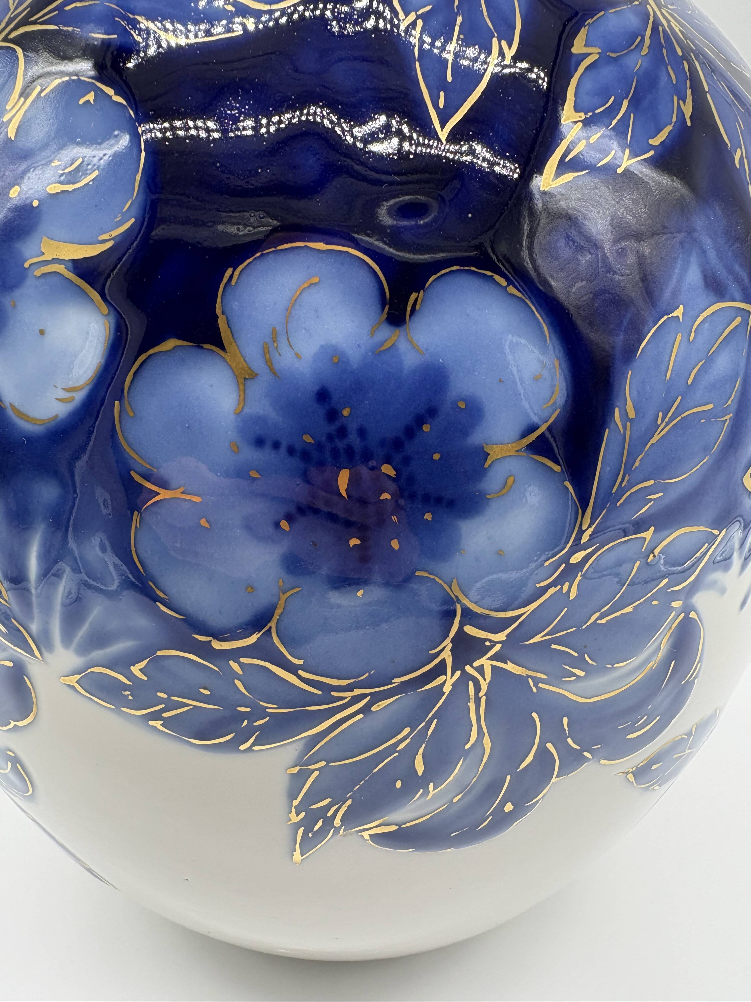 Large Tharaud Limoges vase in cobalt blue porcelain with floral decoration.
