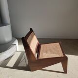 Reclined armchair in canned teak in natural wood