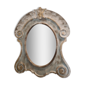 Patinated wooden bull's eye mirror