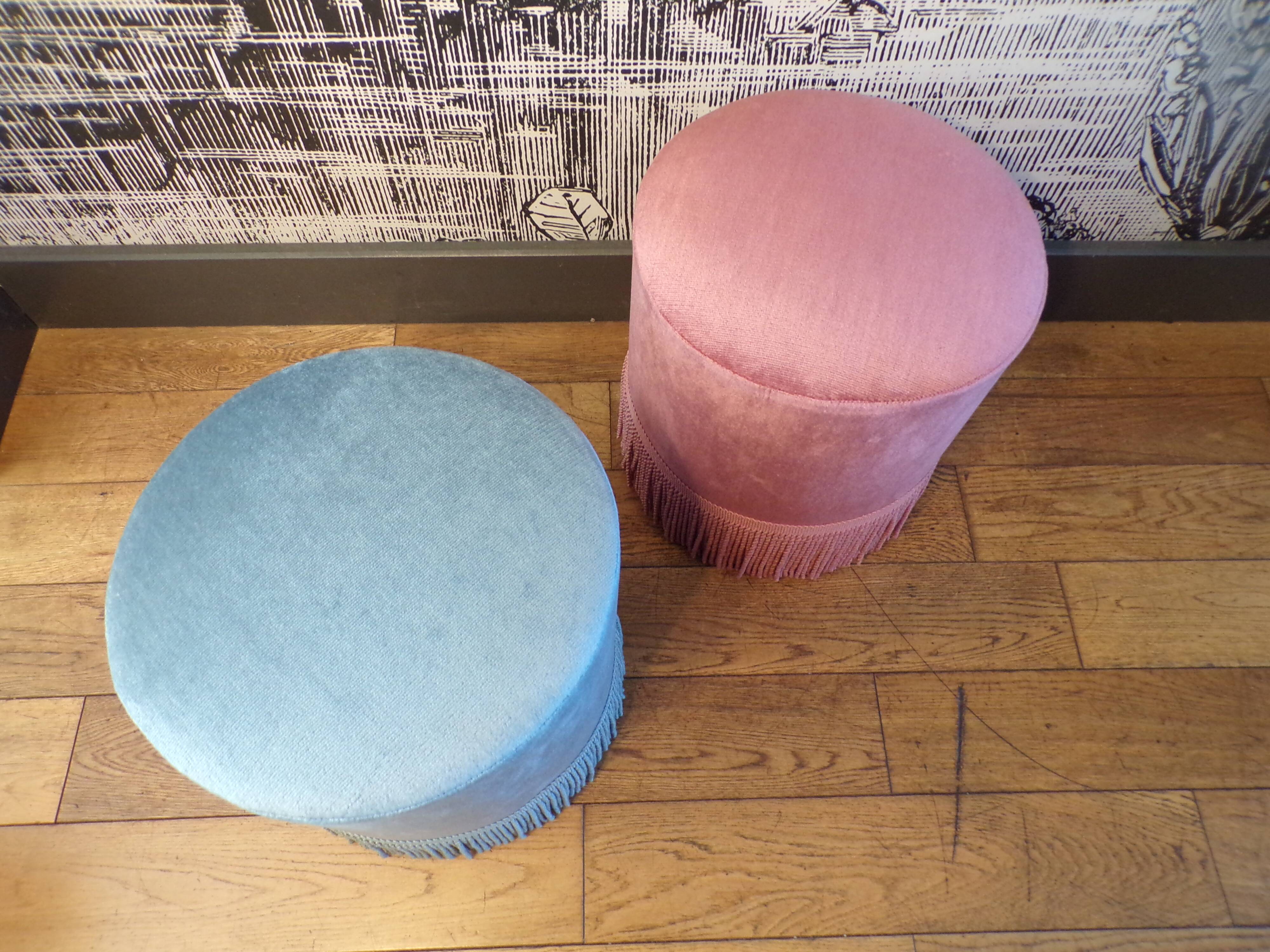A pair of vintage velvet poufs.