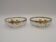 Set of 2 glass and metal bowls with a bow design.