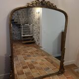Large gilded mirror with pediment
