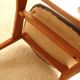 Pair of modernist Scandinavian chairs in teak and black faux leather.