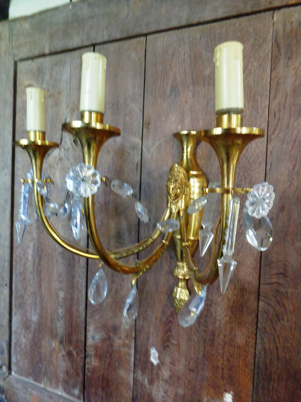 Ancient wall lamp in gilded brass with stamps