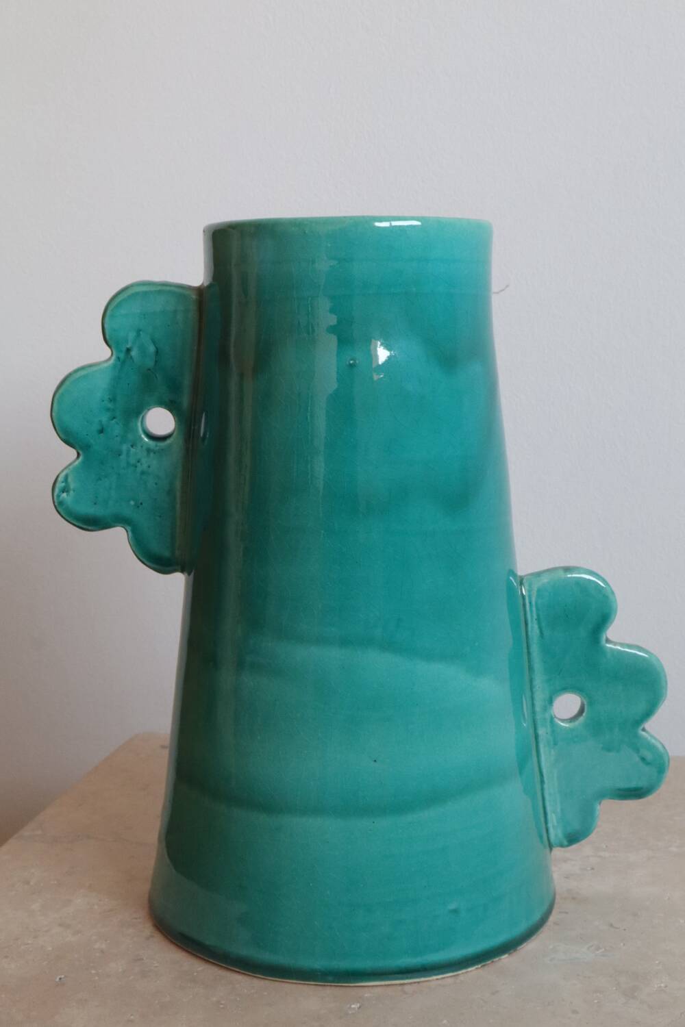 Handmade ceramic abstract vase with large handles and turquoise blue flowers