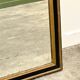 Antique 1800s black and gold mirror with cupid, France 1800s.