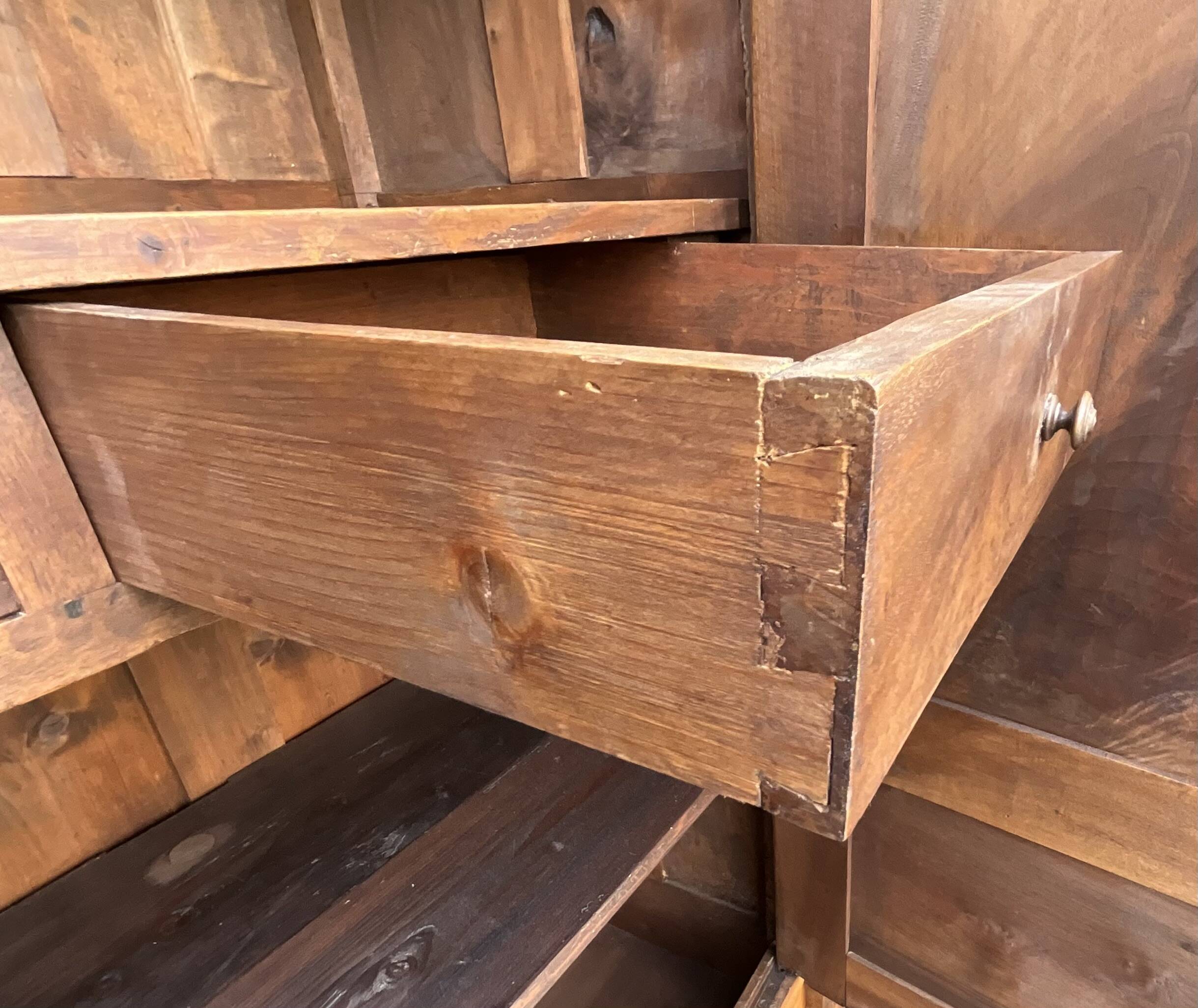 Empire wardrobe in solid walnut, France, mid-19th century.