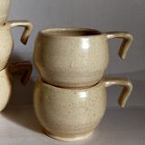 Six vintage potter's ceramic cups with vanilla enamel