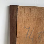 Antique mirror door (left) of a brown oak wardrobe with bevelled glass.