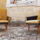 Pair of vintage 60s armchairs in black imitation leather and mustard toffee