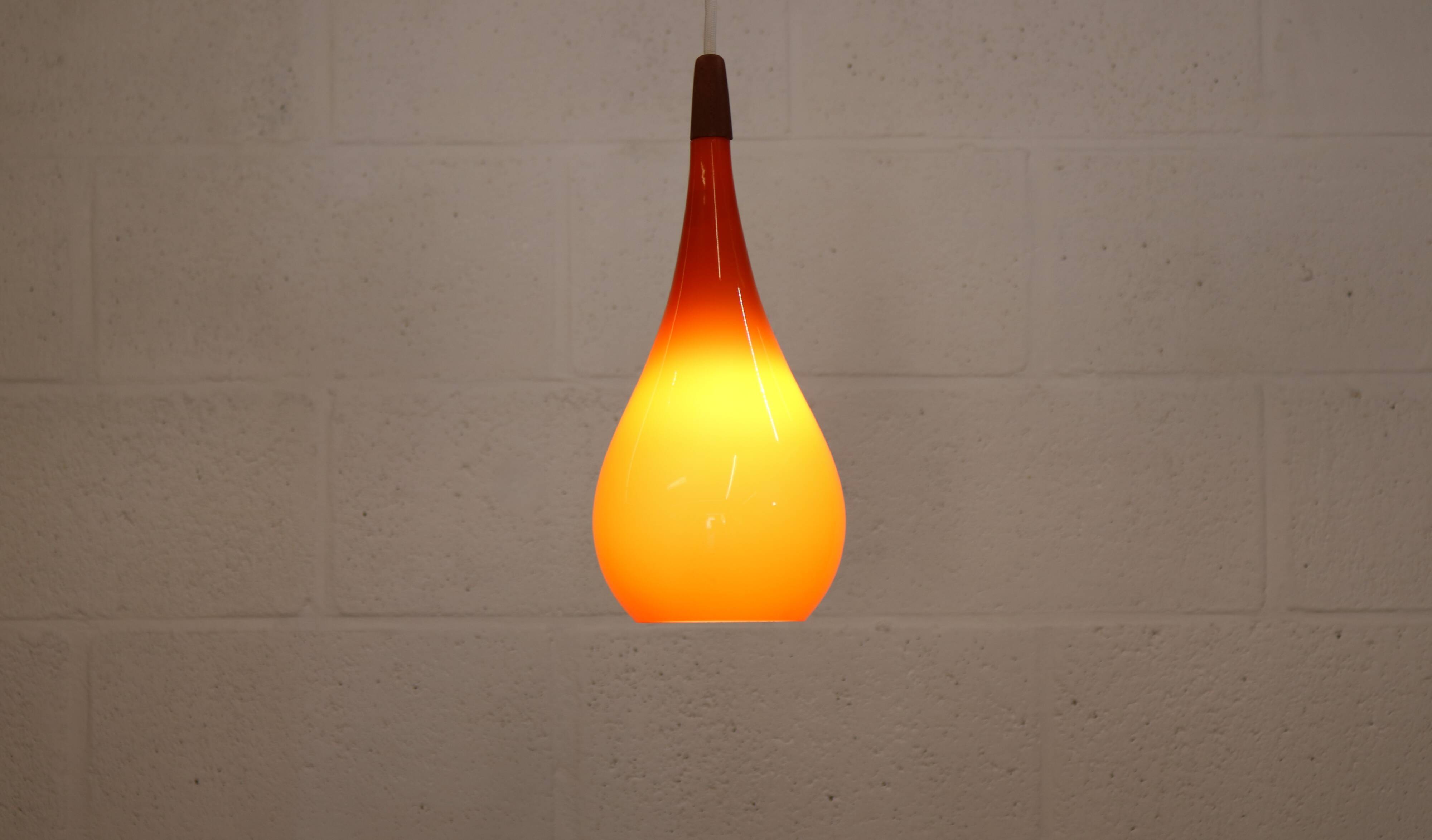 Orange teardrop glass pendant lamp made by Holmegaard - Denmark 1960