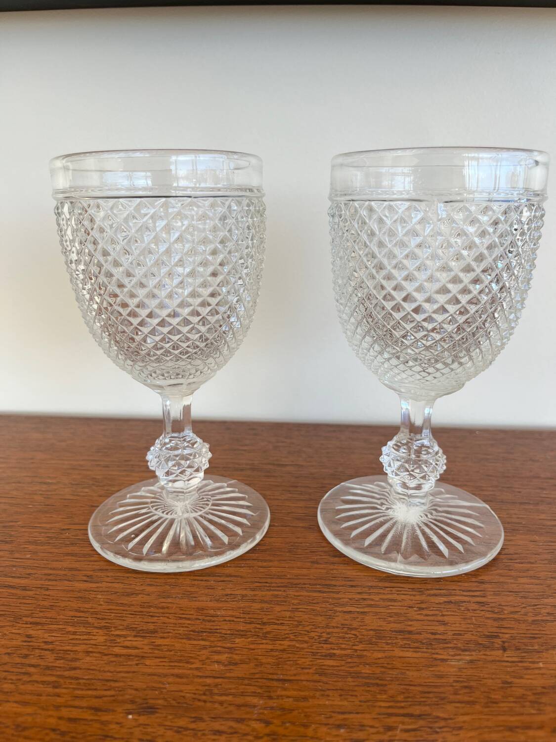 Two 19th-century moulded crystal glasses with diamond points.