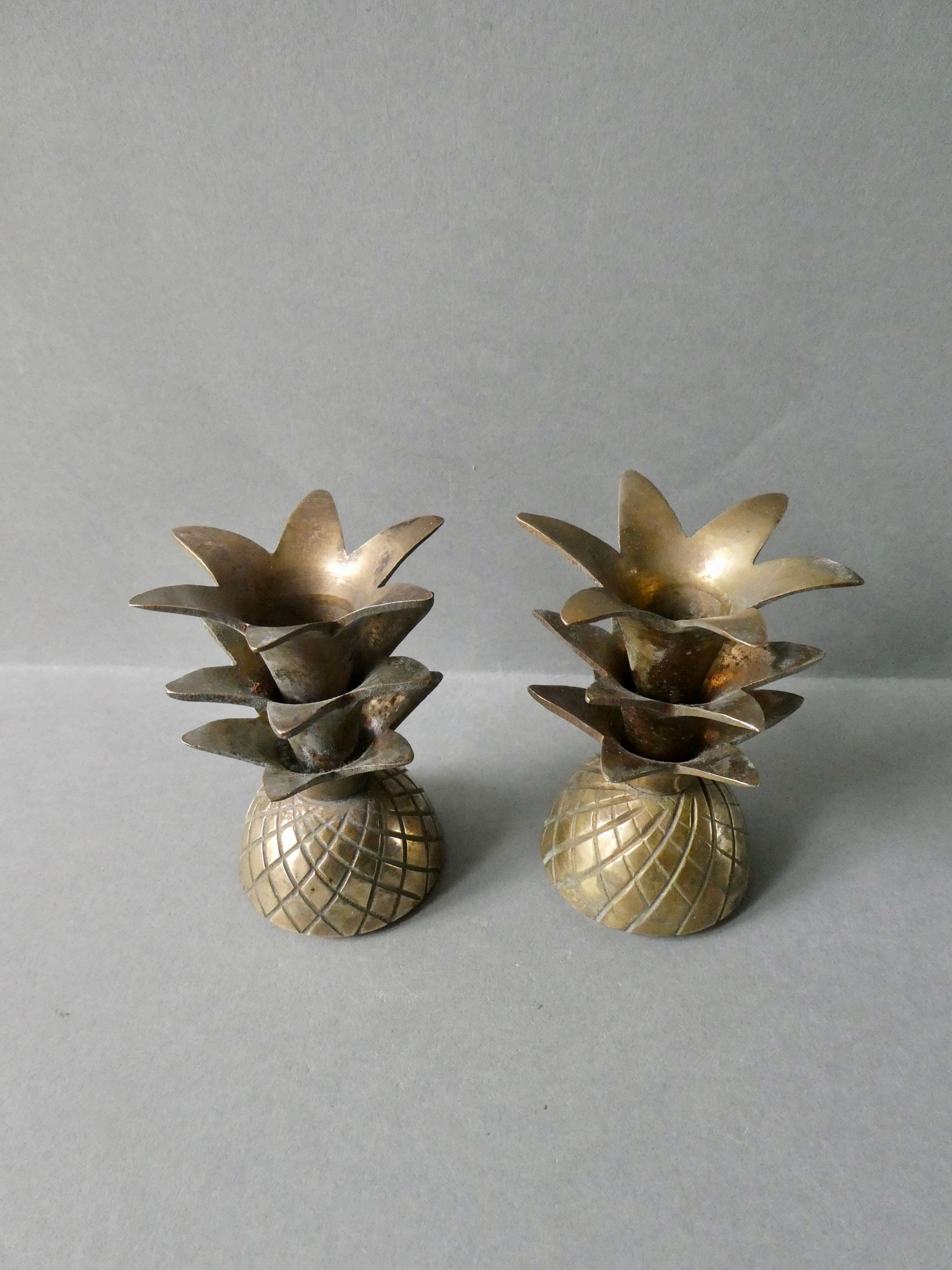 Pair of pineapple candlesticks, brass