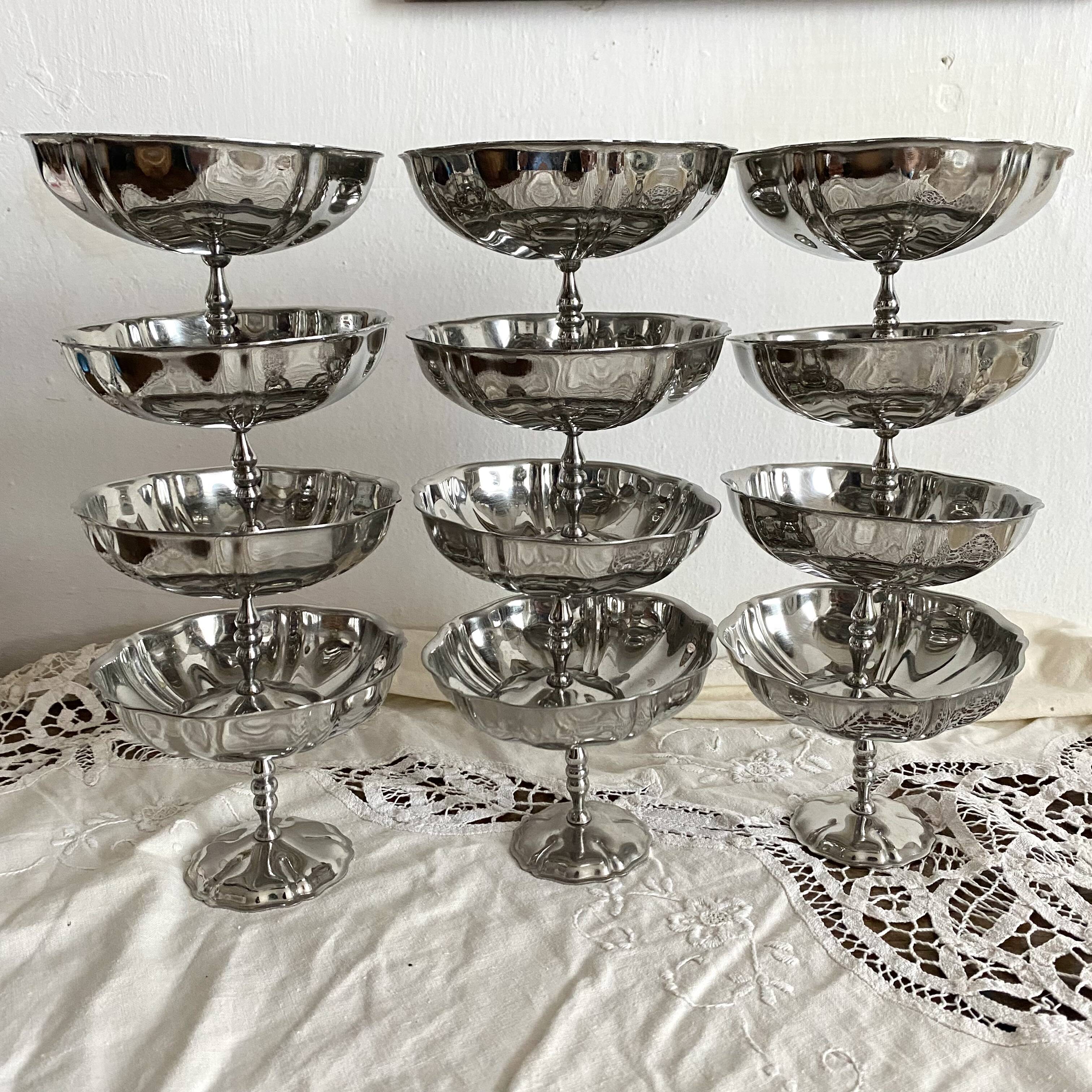 Vintage stainless steel cups on foot