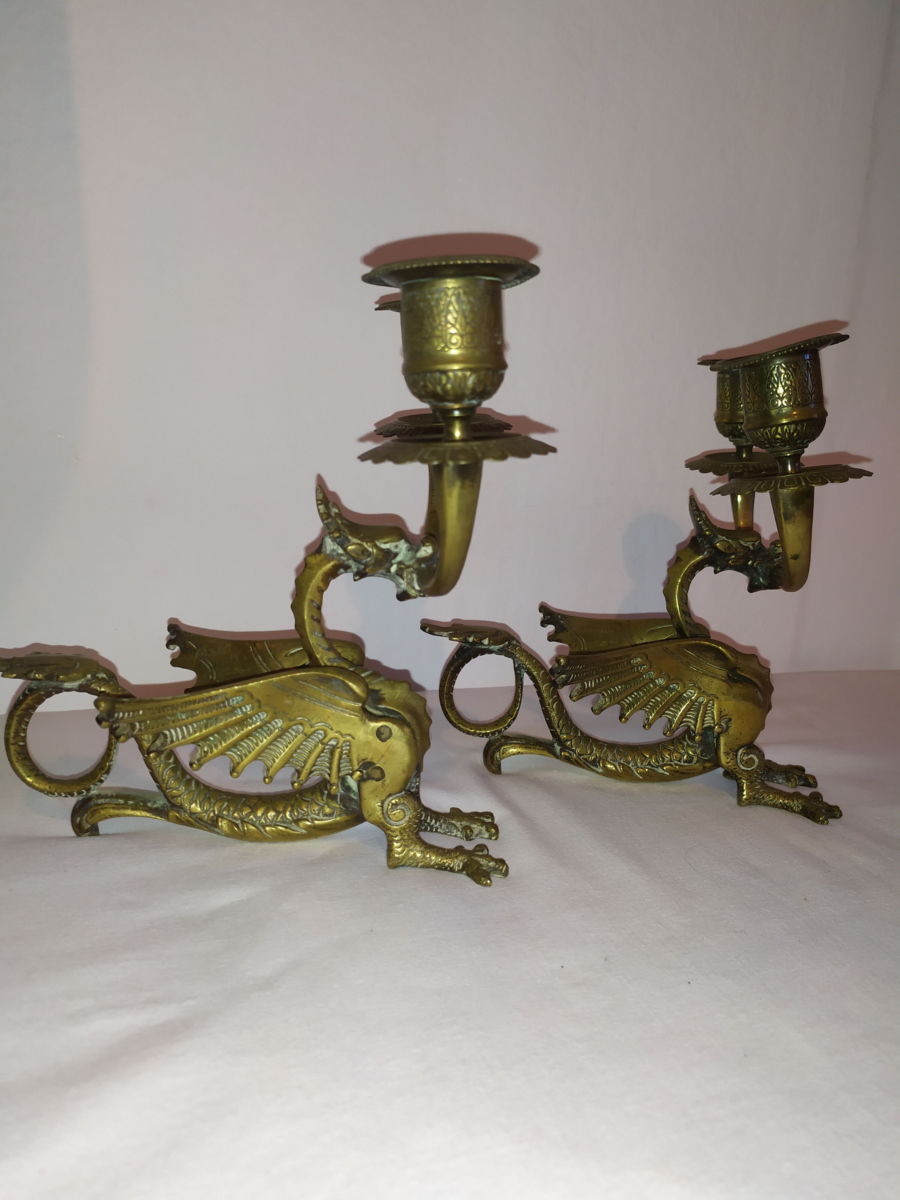 Pair of candlesticks with old chimera dragons hands
