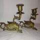 Pair of candlesticks with old chimera dragons hands