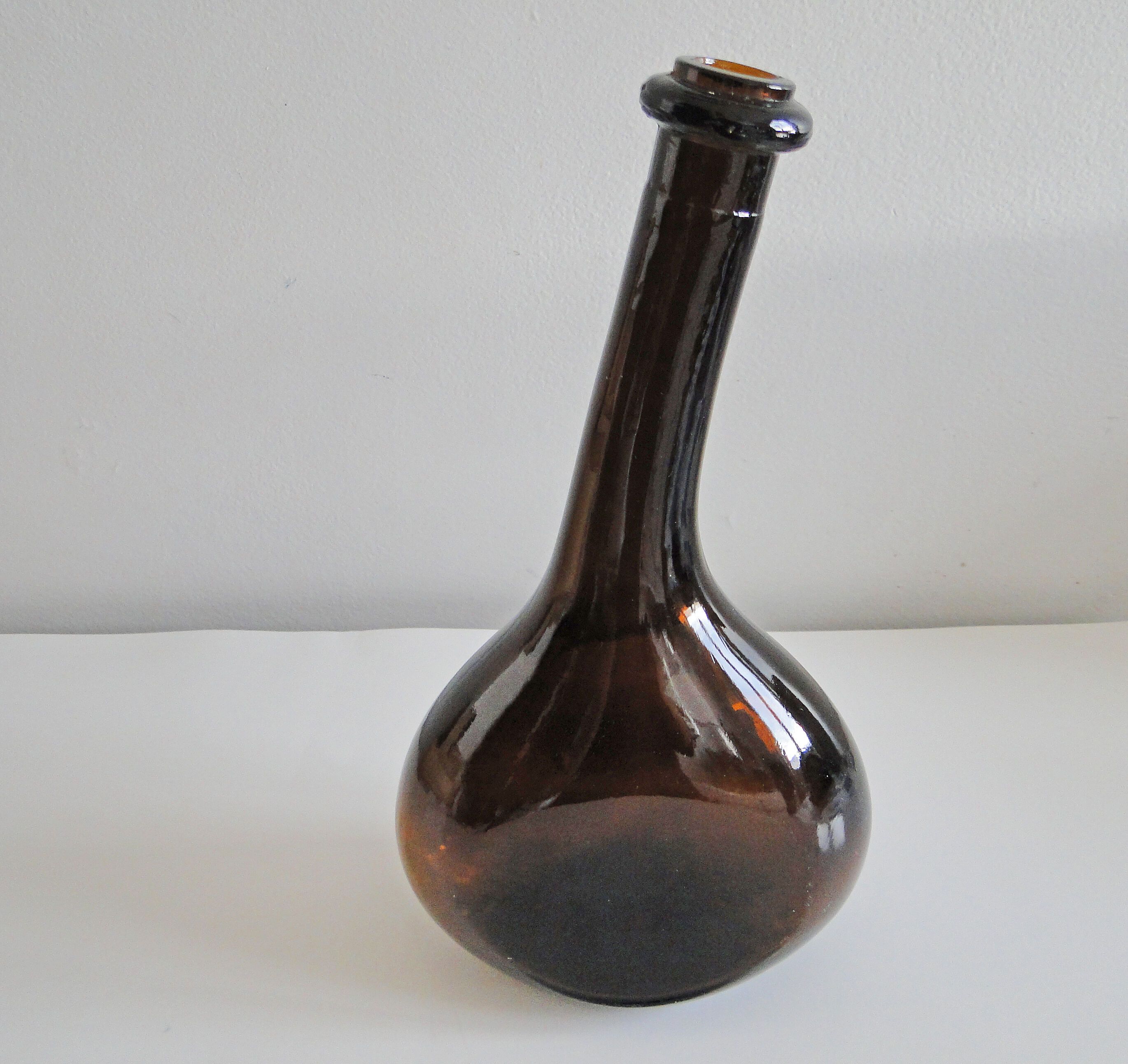 Old and original blown glass bottle with XXth bent neck