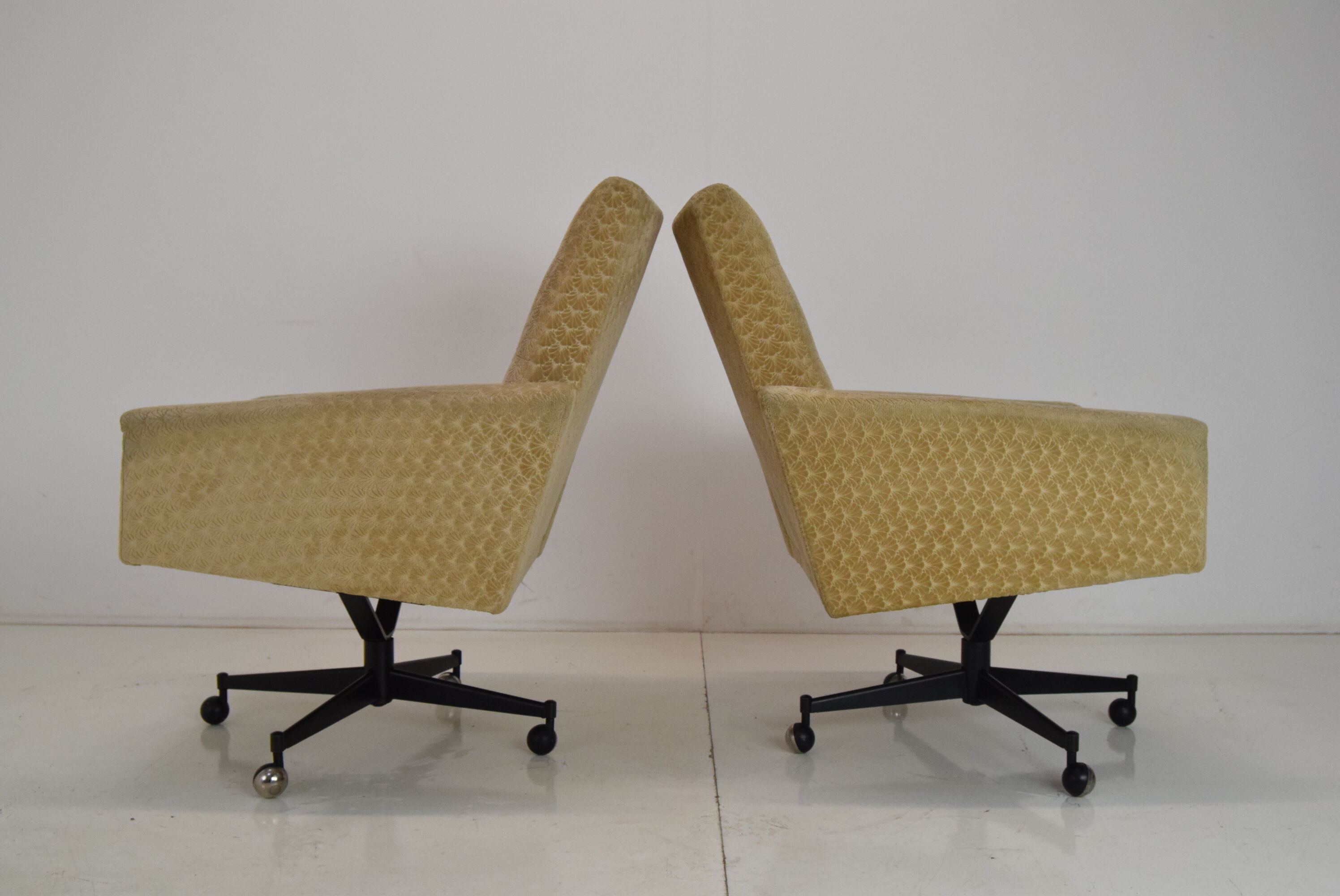 Pair of mid-century swivel armchairs with wheels 1970's