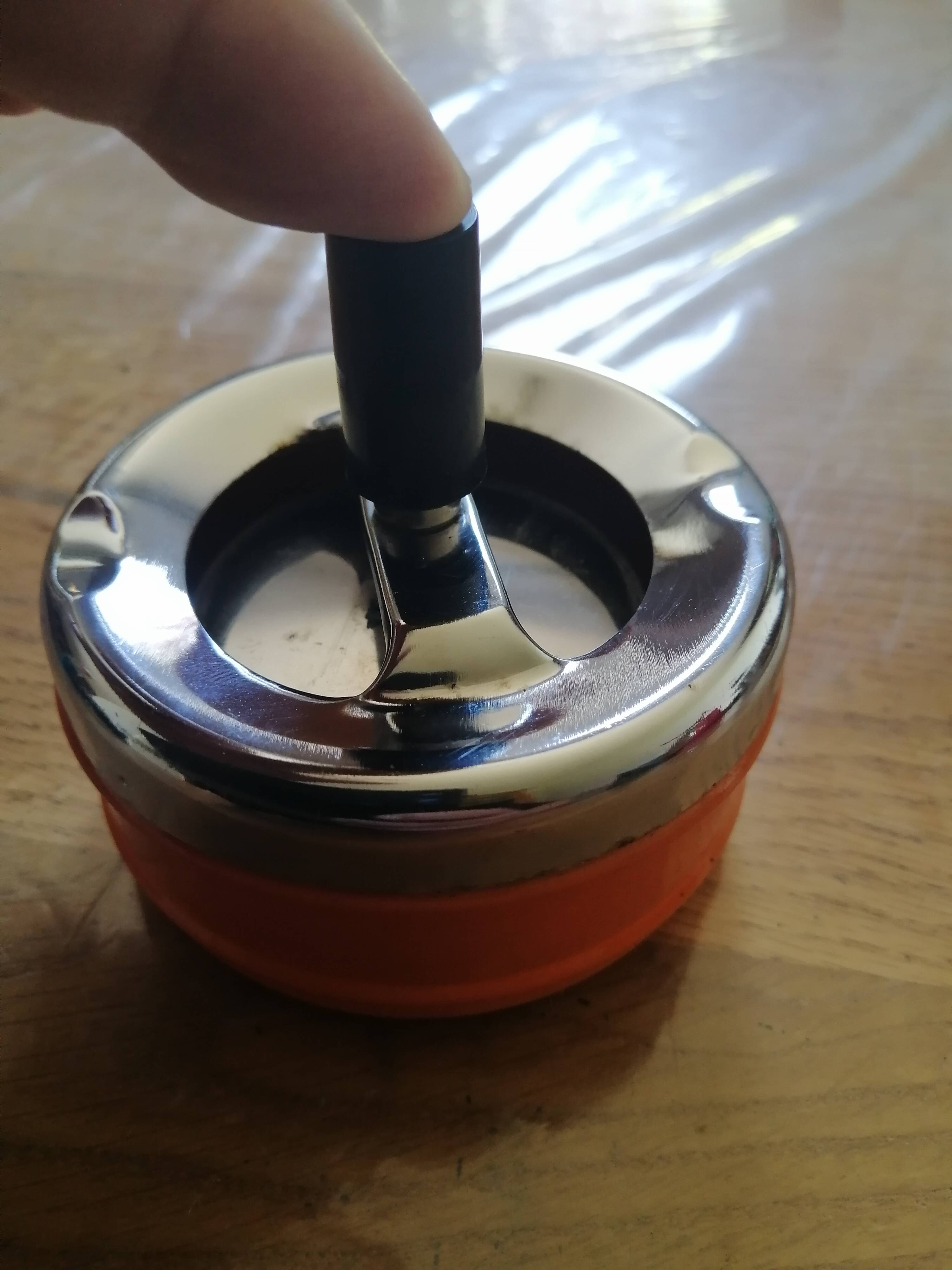 Vintage orange rotating ashtray