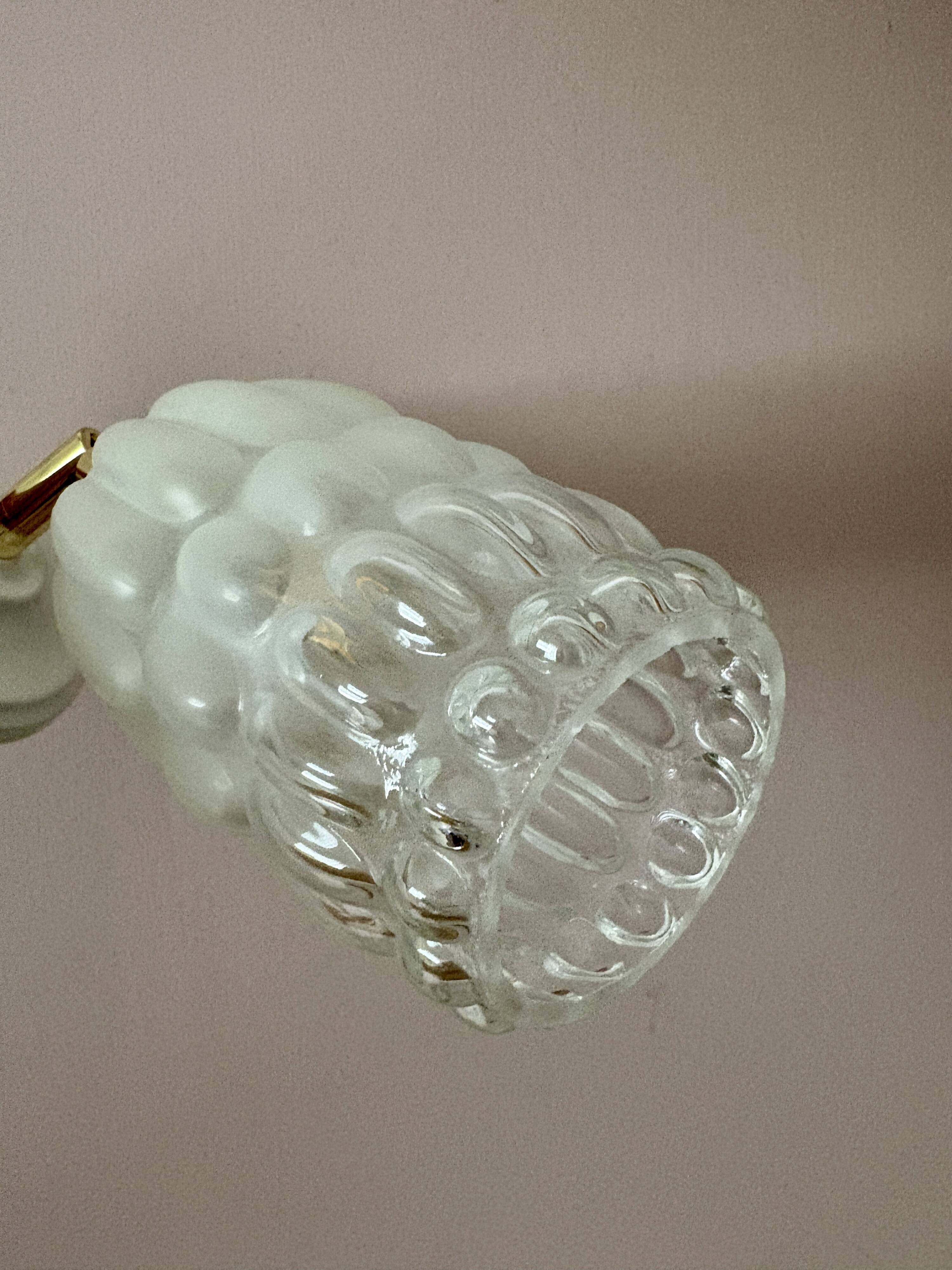 Vintage globe wall lamp in half frosted, half transparent glass