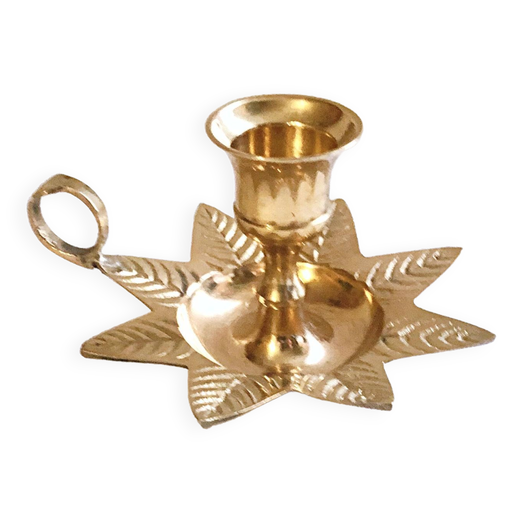 Golden brass hand candle holder decorated with leaves