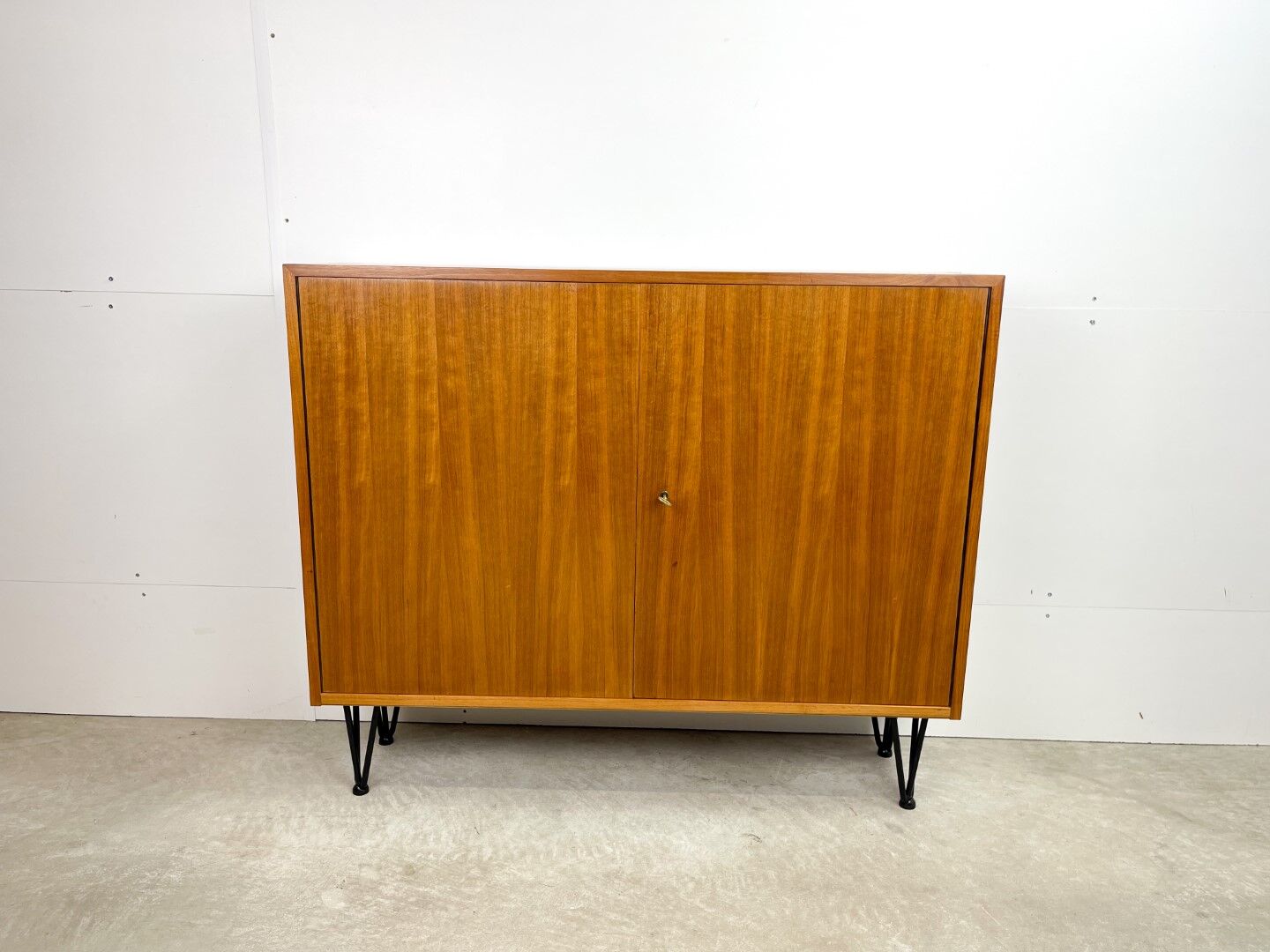 High vintage cabinet with hairpin legs