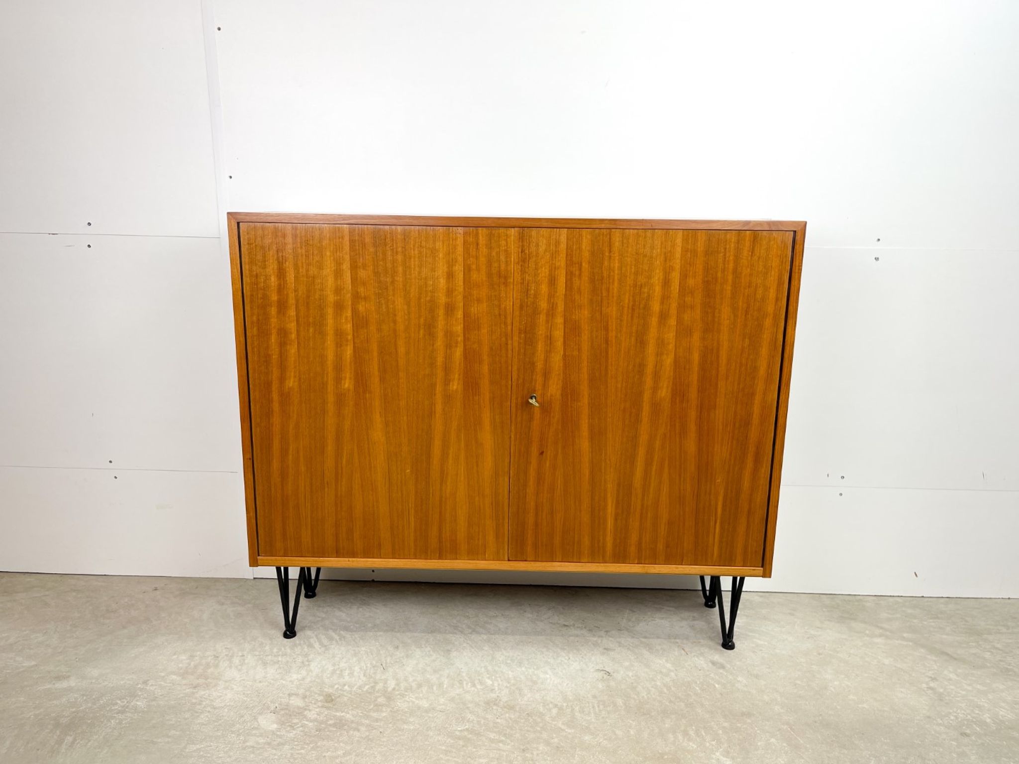 High vintage cabinet with hairpin legs