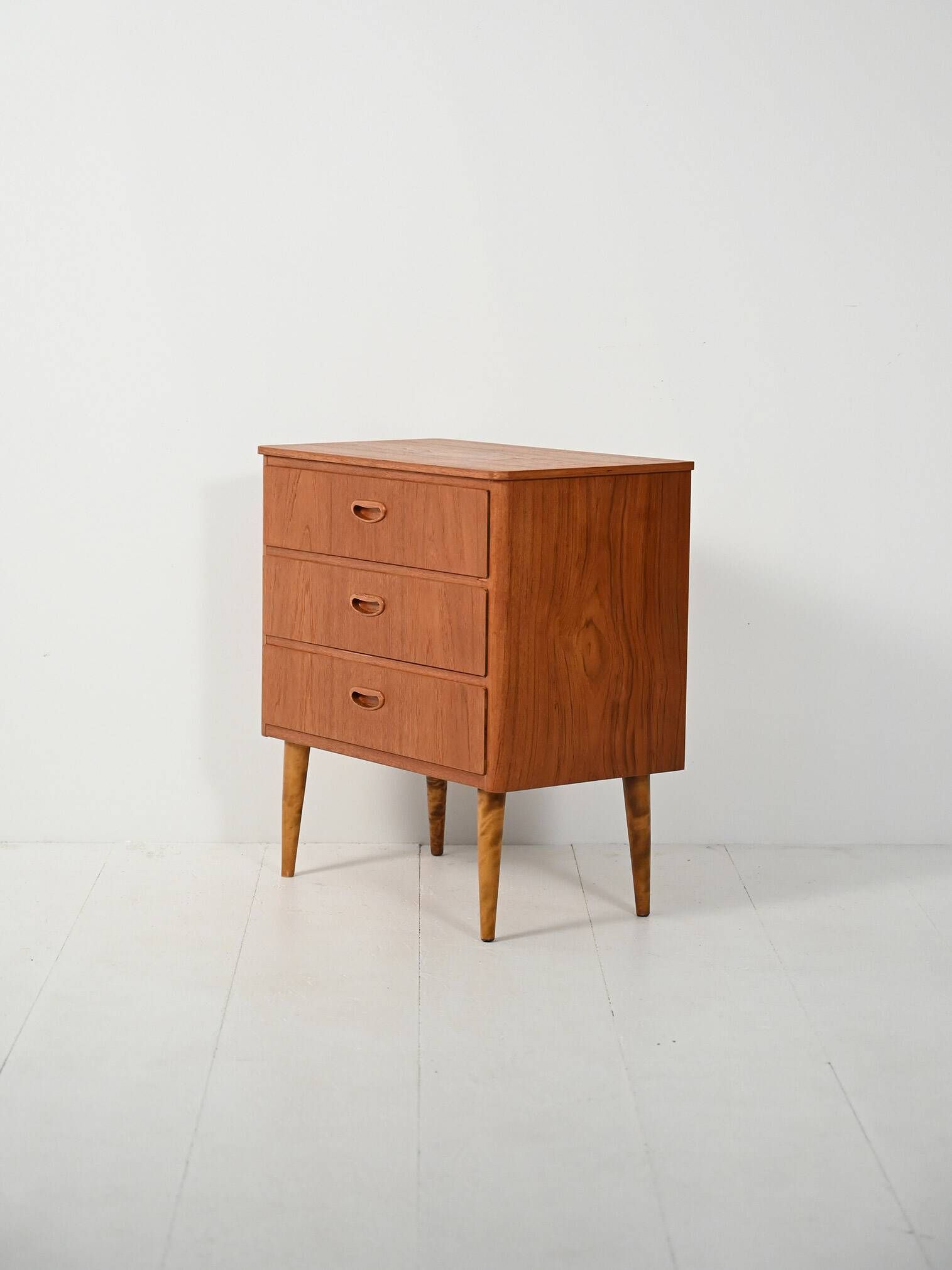 Scandinavian Chest of Drawers in teak with turned birch legs, 1950s