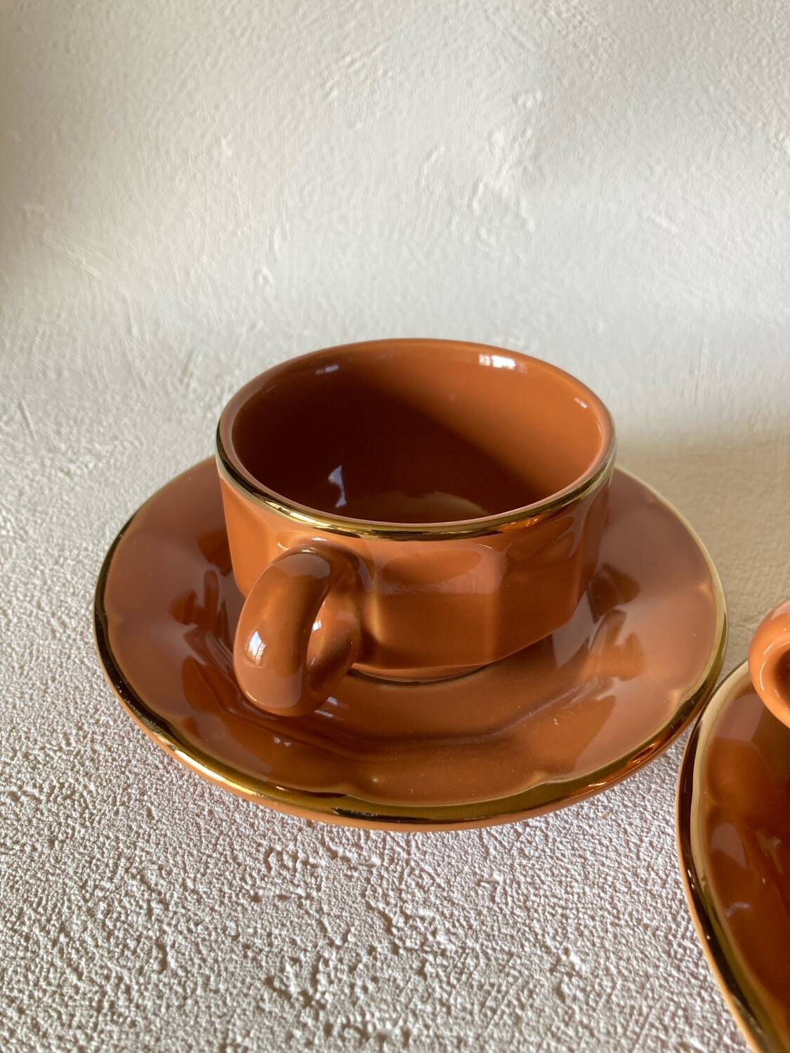 Caramel-colored bistro coffee cups and saucers