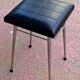 Black faux leather and chrome stool. 1970s, vintage seventies decor.
