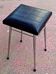 Black faux leather and chrome stool. 1970s, vintage seventies decor.