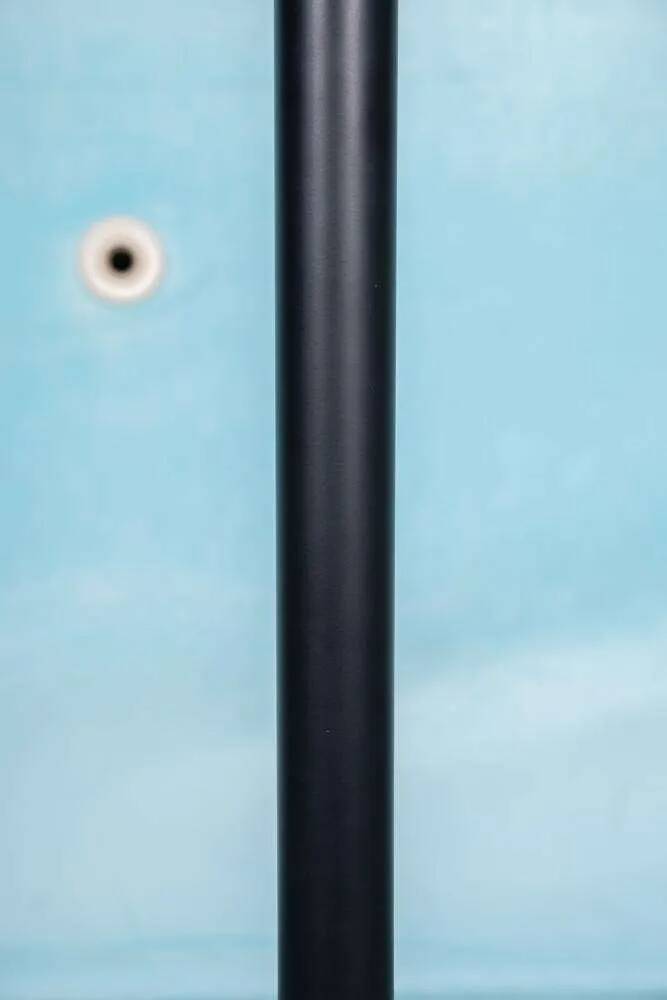 Minimalist floor lamp in glass, space age style.