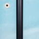 Minimalist floor lamp in glass, space age style.
