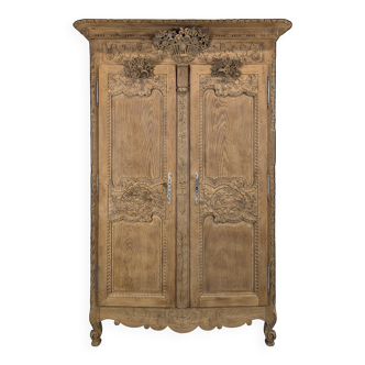 Norman wardrobe, richly carved and stripped.