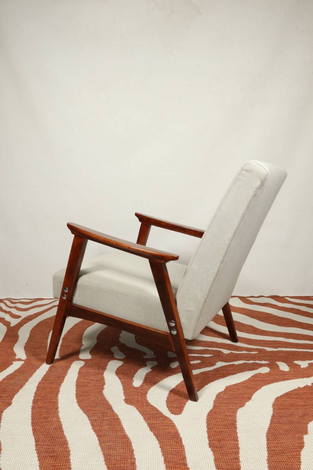 Vintage light gray armchair dark wood Scandinavian design 1970