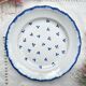 Antique French Earthenware Plate from the 19th century with small blue flower motif