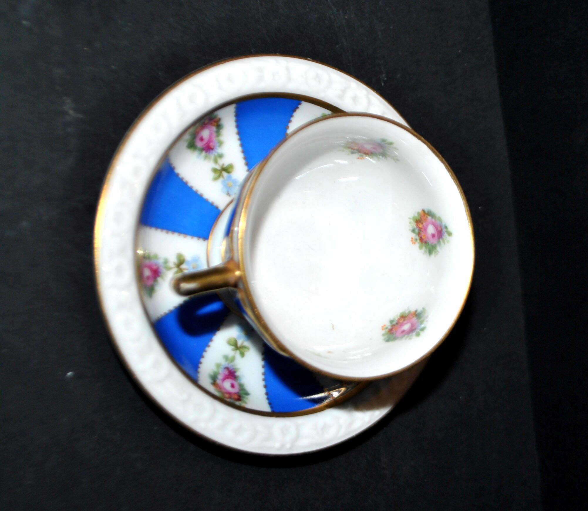 Maria collector's cup in blue and gold German porcelain.