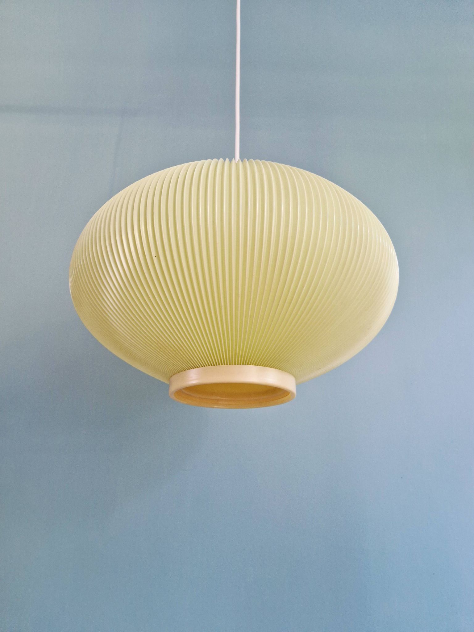 Vintage oval-shaped suspension in pleated celluloid, light green colour, 1960.