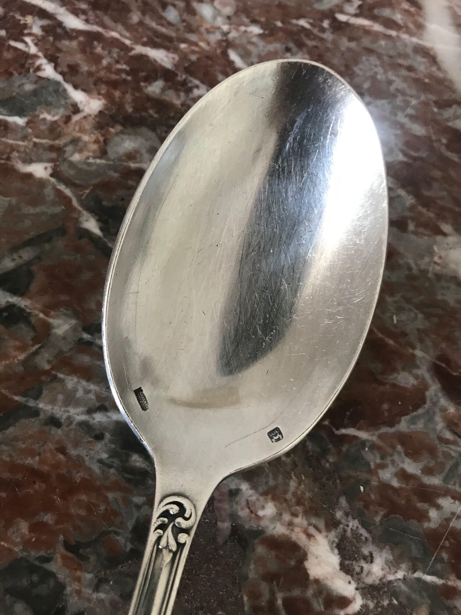 Set of 7 tablespoons in flowered silver metal with punch