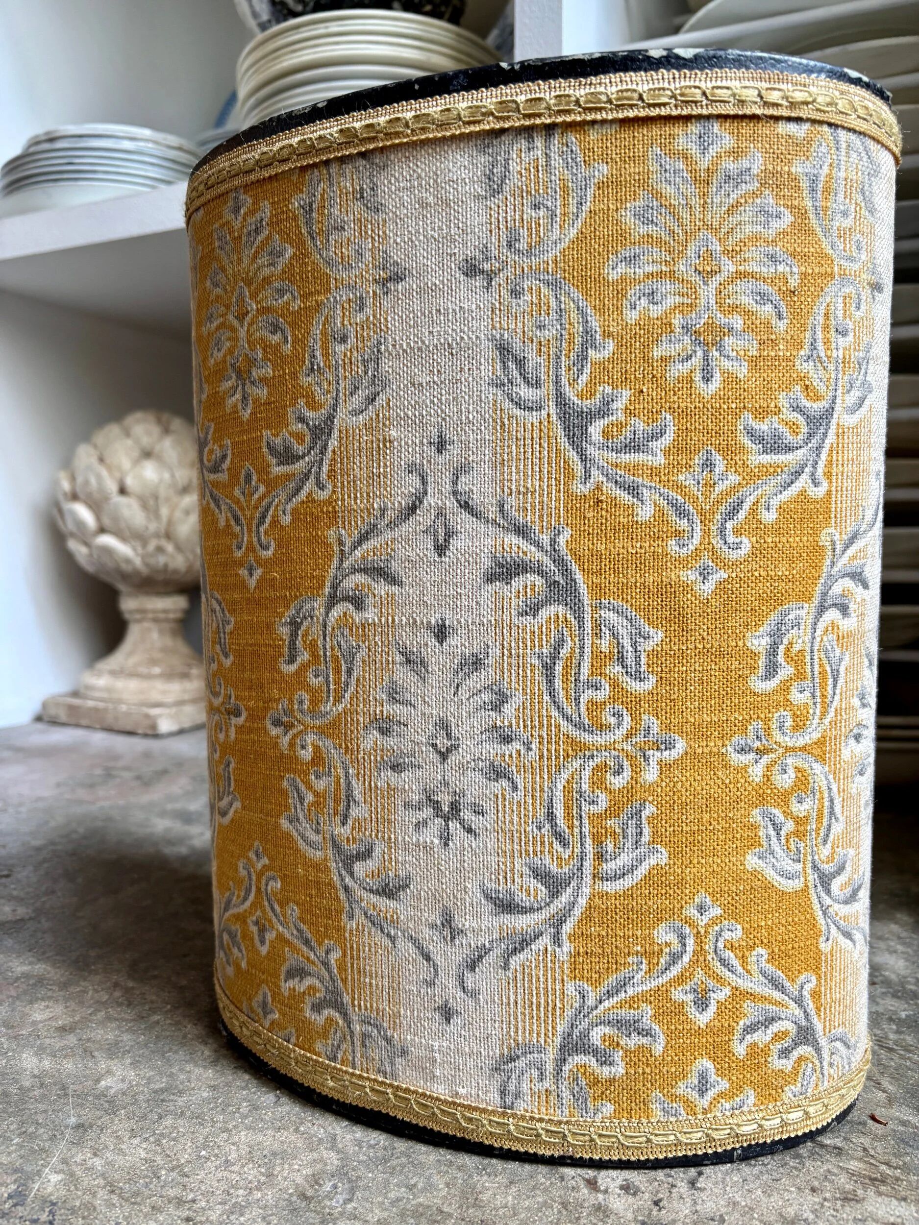Oval paper bin in woven ochre and grey cotton