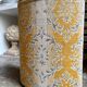 Oval paper bin in woven ochre and grey cotton